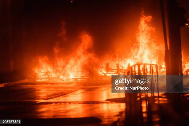 Wooden palettes burn as prison guards block access to Fresnes prison on January 22, 2018 to demand tighter security. French prison officers blocked...