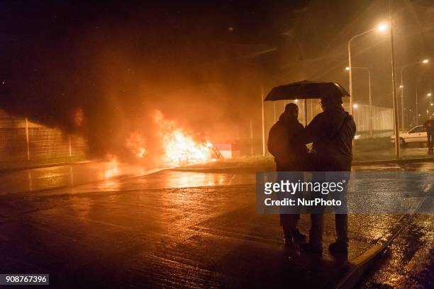 Jail workers look Wooden palettes burn as prison guards block access to Fresnes prison on January 22, 2018 to demand tighter security. French prison...