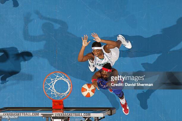 Cheryl Ford of the Detroit Shock lays up a shot against Quanitra Hollingsworth of the Minnesota Lynx during the game on September 9, 2009 at the...