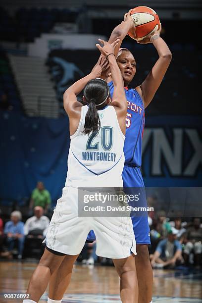 Kara Braxton of the Detroit Shock looks to move the ball against Renee Montgomery of the Minnesota Lynx during the game on September 9, 2009 at the...