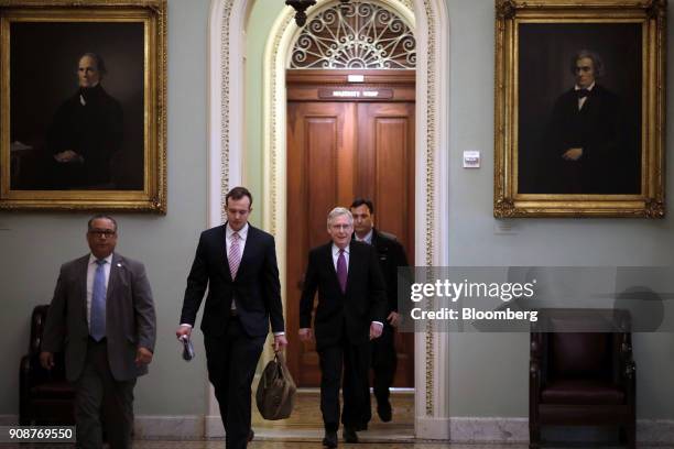 Senate Majority Leader Mitch McConnell, a Republican from Kentucky, second right, arrives at the U.S. Capitol during the third day of the U.S....