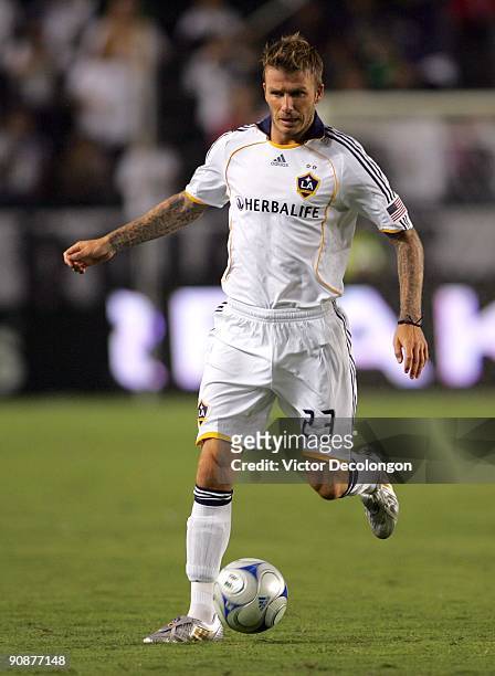 David Beckham of the Los Angeles Galaxy paces the ball on the attack in the second half during the MLS match against FC Dallas at The Home Depot...