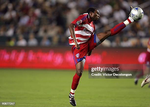 Jeff Cunningham of FC Dallas stretches his left leg to play down a crossing pass to the goal box in the first half against the Los Angeles Galaxy...