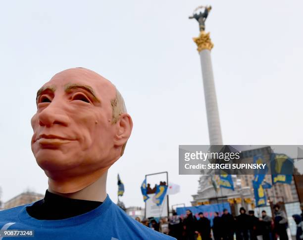 This photo taken on January 22, 2018 in Independence Square in Kiev shows a mannequin depicting Russian President Vladimir Putin dressed in a...