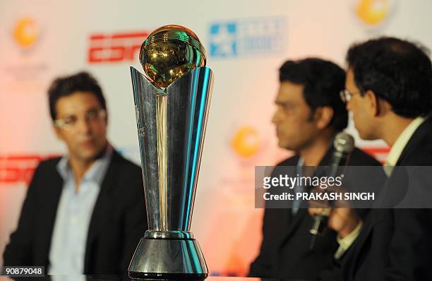 Replica of The International Cricket Council Champions Trophy on display as ESPN Star sports Commentators Harsha Bhogle , Sanjay Manjrekar and Wasim...