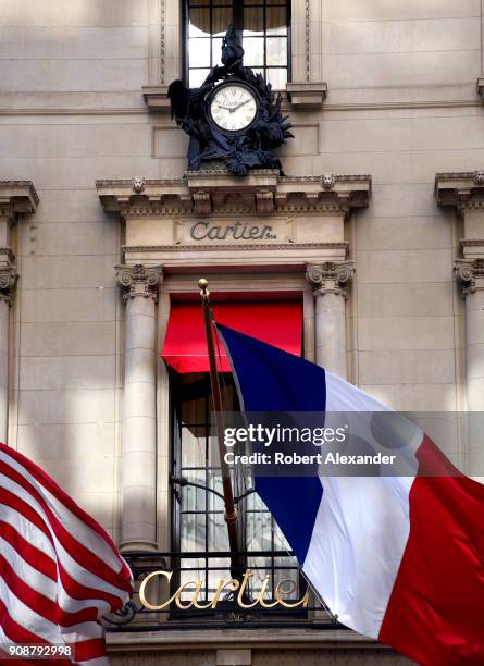 Flags fly from the Cartier Building on Fifth Avenue in New York City. Now known as the Cartier Building, the Manhattan landmark was originally the...