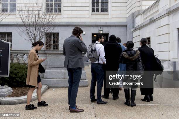 Staff members stand in line outside the Russell Senate Office building during the government shutdown on Capitol Hill in Washington, D.C., U.S., on...