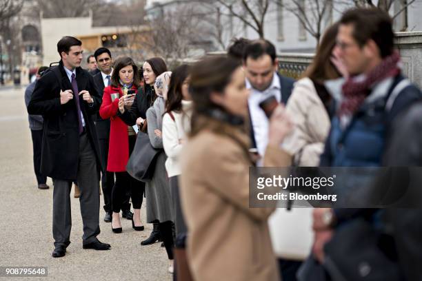 Staff members stand in line outside the Russell Senate Office building during the government shutdown on Capitol Hill in Washington, D.C., U.S., on...