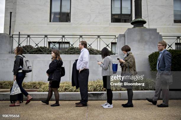 Staff members stand in line outside the Dirksen Senate Office building during the government shutdown on Capitol Hill in Washington, D.C., U.S., on...
