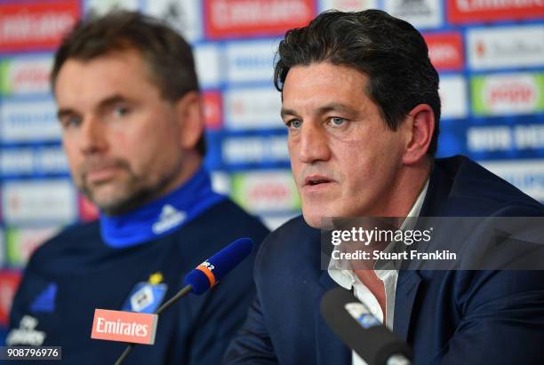 Jens Todt, sports director of Hamburger SV talks to the media as Bernd Hollerbach, new head coach of Hamburger SV looks on during a press conference...