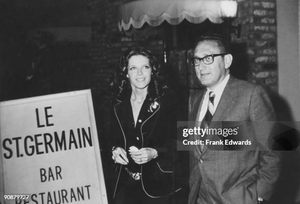 American diplomat Henry Kissinger with actress Samantha Eggar outside the Le St Germain Restaurant in Hollywood, November 1971. They are attending an...