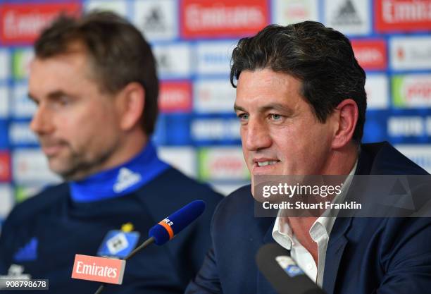 Jens Todt, sports director of Hamburger SV talks to the media as Bernd Hollerbach, new head coach of Hamburger SV looks on during a press conference...