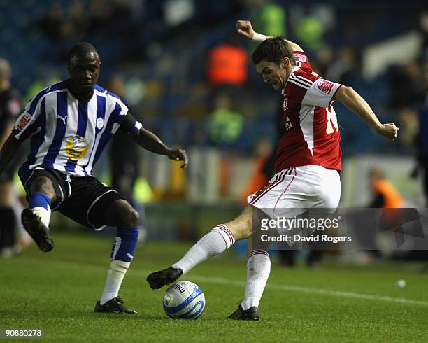 Adam Johnson of Middlesbrough plays the ball past Jermaine Johnson during the Coca- Cola Championship match between Sheffield Wednesday and...