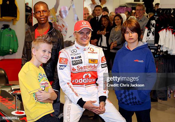 Formula 1 driver Heikki Kovalainen poses for a photograph as he launches his Grand Prix-themed boyswear range 'Living the Dream' produced exclusively...