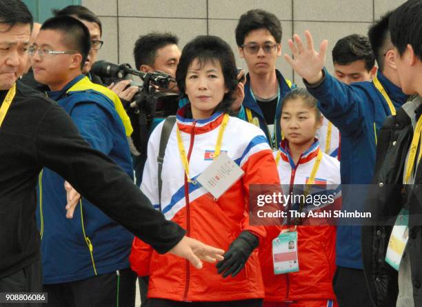 Ryom Tae Ok and Kim Ju Sik of North Korean leaves the venue with being surrounded by security staffs ahead of the Four Continents Figure Skating...