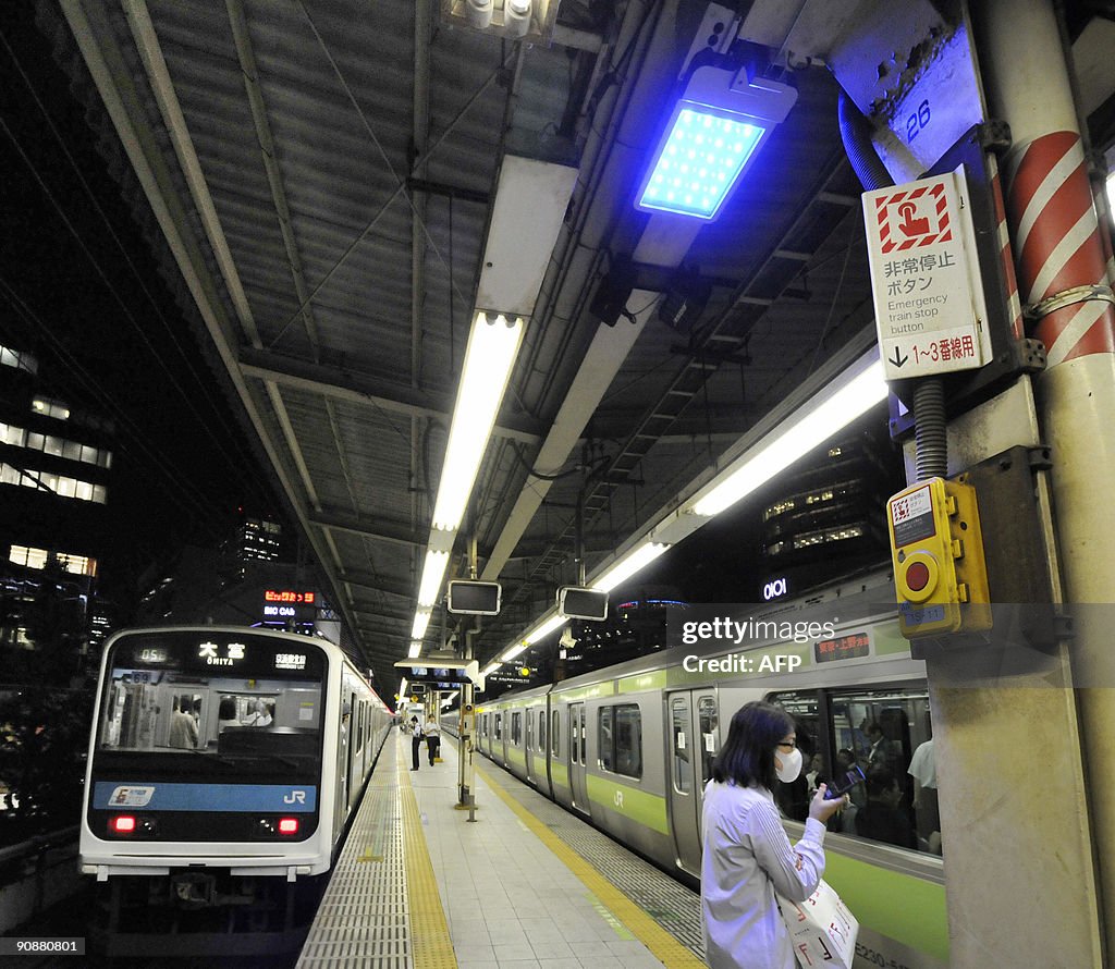 A blue LED ceiling lamp is placed on the