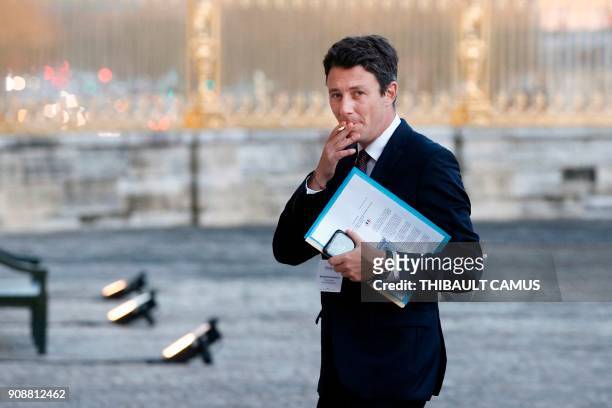 French Government's Spokesperson Benjamin Griveaux smokes a cigarette within the "Choose France" summit at the Chateau de Versailles, near Paris, on...