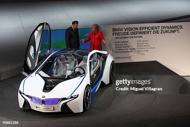 German carmaker BMW's CEO Norbert Reithofer shows the BMW Vision Efficient Dynamics concept car to German Chancellor Angela Merkel at the BMW...