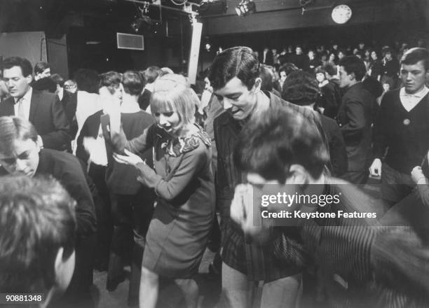 Young mods dancing during a recording of the British pop music TV programme 'Ready Steady Go!', London February 1964. At centre are resident...