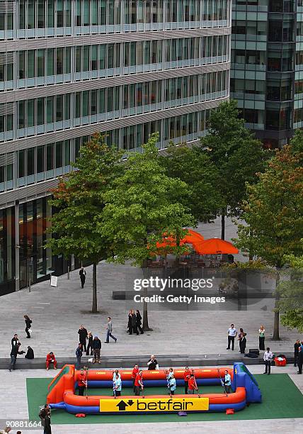 Manchester United legend Alex Stepney referees the Betfair Manchester Derby photo call on September 17, 2009 in Manchester. Betfair have just...