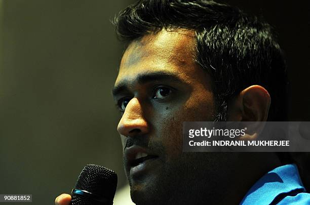 Indian cricket captain Mahendra Singh Dhoni speaks at a pre-departure press conference in Mumbai on September 17, 2009. The Indian cricket team led...