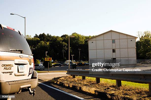 Police vehicle moves into the parking lot of a Super 8 Motel to make an arrest in connection with the murder of Yale University graduate student...