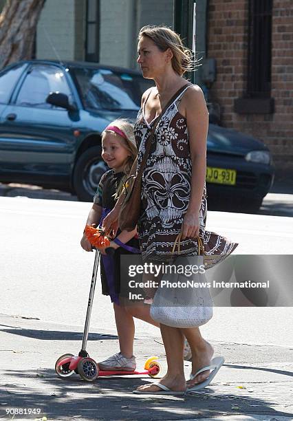 Fashion designer Collette Dinnigan walks with her daughter Estella Sophia Dinnigan Wilkins on Oxford Street, Paddington on September 16, 2009 in...