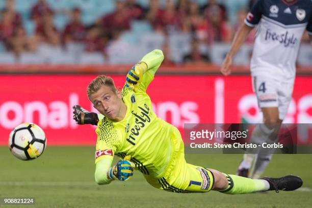 January 19: Goalkeeper Matthew Acton of the Victory dives to stop a goal during the round 17 A-League match between the Western Sydney Wanderers and...