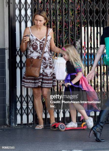 Fashion designer Collette Dinnigan walks with her daughter Estella Sophia Dinnigan Wilkins on Oxford Street, Paddington on September 16, 2009 in...