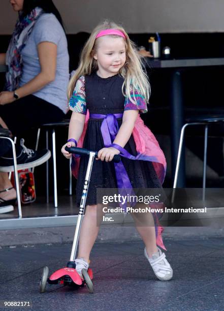 Fashion designer Collette Dinnigan walks with her daughter Estella Sophia Dinnigan Wilkins on Oxford Street, Paddington on September 16, 2009 in...