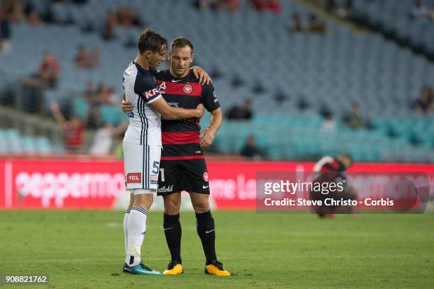 January 19: Brendon Santalab of the Wanderers speaks to Victory's Mark Milligan after the round 17 A-League match between the Western Sydney...