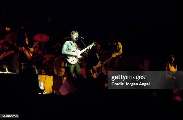 John Lennon, Arthur Kaplan and Yoko Ono perform on stage with the Elephant's Memory Band at Madison Square Garden on August 30th 1972 in New York.