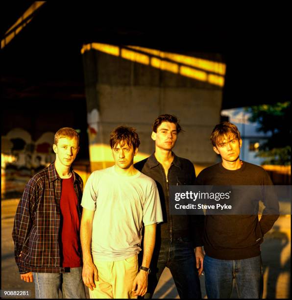 English rock group Blur pose under London's Westway, 20th July 1995. From left to right, drummer Dave Rowntree, guitarist Graham Coxon, bassist Alex...