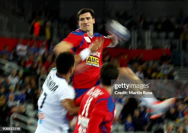 Nemanja Zelenovic of Serbia challenges Adrien Dipanda of France during the Men's Handball European Championship main round match between Serbia and...