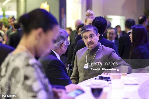 Uday Kotak, billionaire and chairman of Kotak Mahindra Bank Ltd., center right, speaks to an attendee ahead of the World Economic Forum in Davos,...