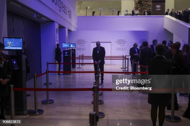 Member of staff adjusts queuing barriers ahead of the World Economic Forum in Davos, Switzerland, on Monday, Jan. 22, 2018. World leaders,...