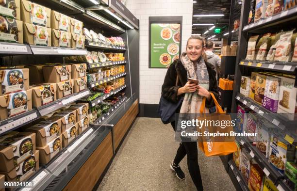 Shopper Ela Ustel walks through the Amazon Go store, on January 22, 2018 in Seattle, Washington. After more than a year in beta Amazon opened the...