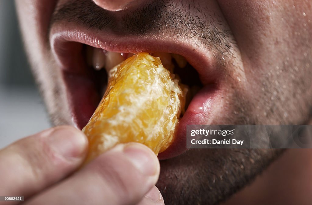 Man eating fruit