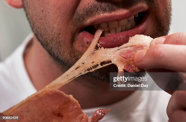 man eating bacon - tear face stock pictures, royalty-free photos & images