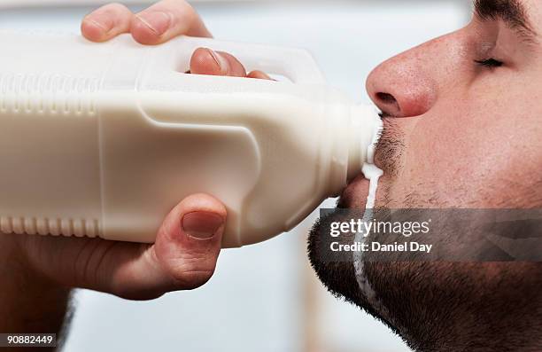 man drinking milk - drinks stock pictures, royalty-free photos & images