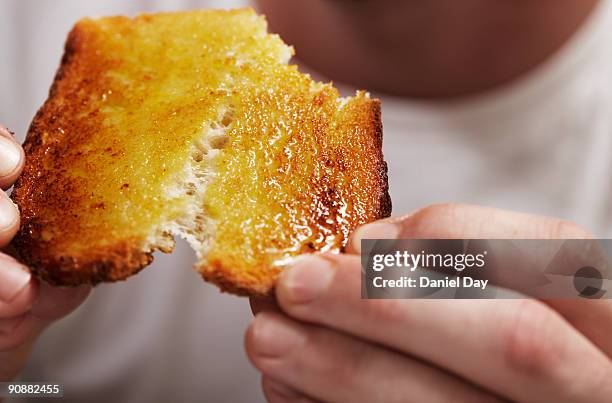 man breaking bread  - bread butter stock pictures, royalty-free photos & images