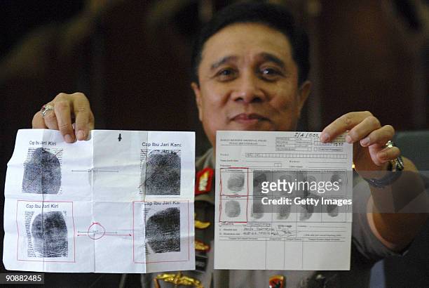 Indonesian National Police Chief Gen. Bambang Hendarso Danuri shows the fingerprints taken from one of the bodies of a suspected terrorist killed in...