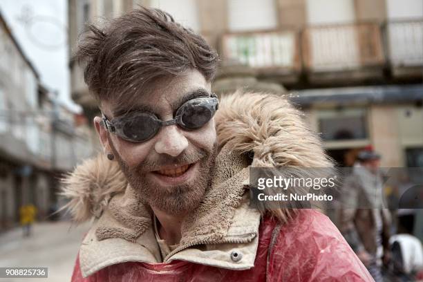 People take part in the 'Sunday Fareleiro', on January 21, 2018 on Xinzo de Limia , Spain. This is the first day of carnaval in the village of Xinzo...