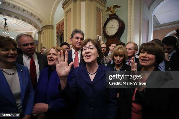 Sen. Susan Collins , celebrates with fellow Senators after the Senate voted and passed the a CR to reopen the government, at the U.S. Capitol on...