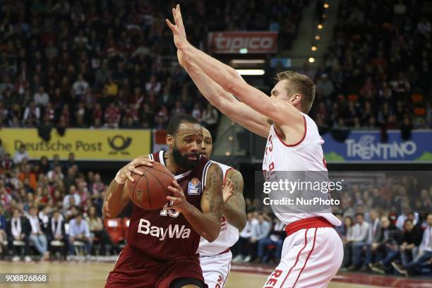 Leon Radosevic of Brose Baskets Bamberg vies Reggie Redding of Bayern Muenchen during the Quarterfinal match in the BBL Pokal 2017/18 between FC...