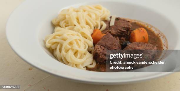 boeuf en daube provençal served with noodles. - black pepper stock pictures, royalty-free photos & images