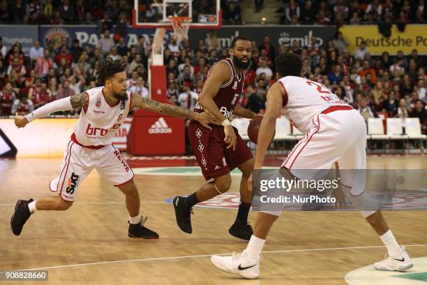 Daniel Hackett of Brose Baskets Bamberg vies Reggie Redding of Bayern Muenchen during the Quarterfinal match in the BBL Pokal 2017/18 between FC...