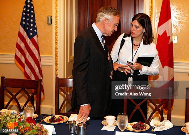 Senate Majority Leader Sen. Harry Reid talks to his National Security Adviser Jessica Lewis prior to a meeting with Canadian Prime Minister Stephen...
