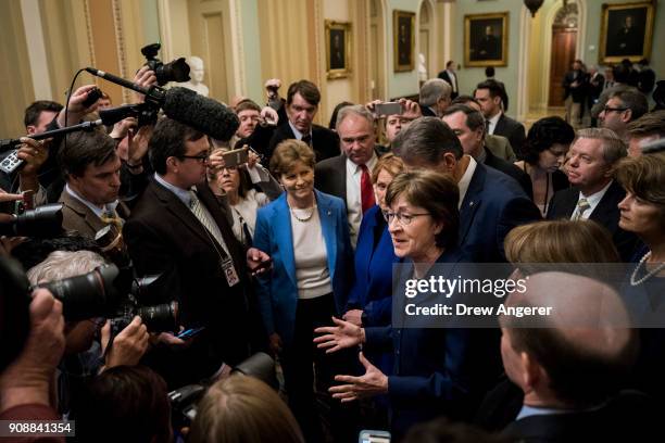 Sen. Susan Collins leads a group of bipartisan Senators as they speak to reporters after the Senate passed a procedural vote for a continuing...