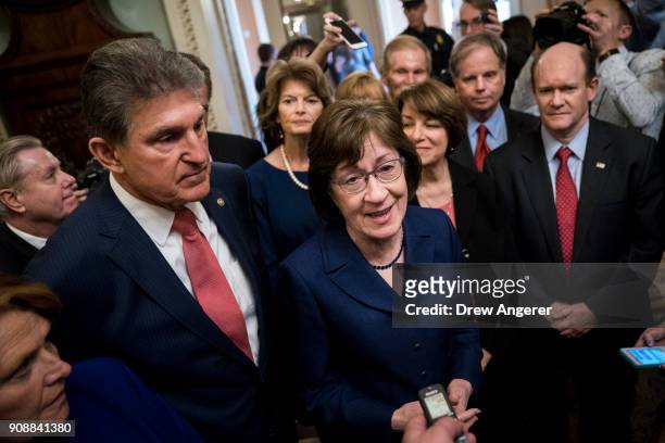 Senators Joe Manchin and Susan Collins lead a group of bipartisan Senators as they speak to reporters after the Senate passed a procedural vote for a...